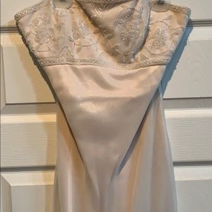 Off white beaded prom gown.